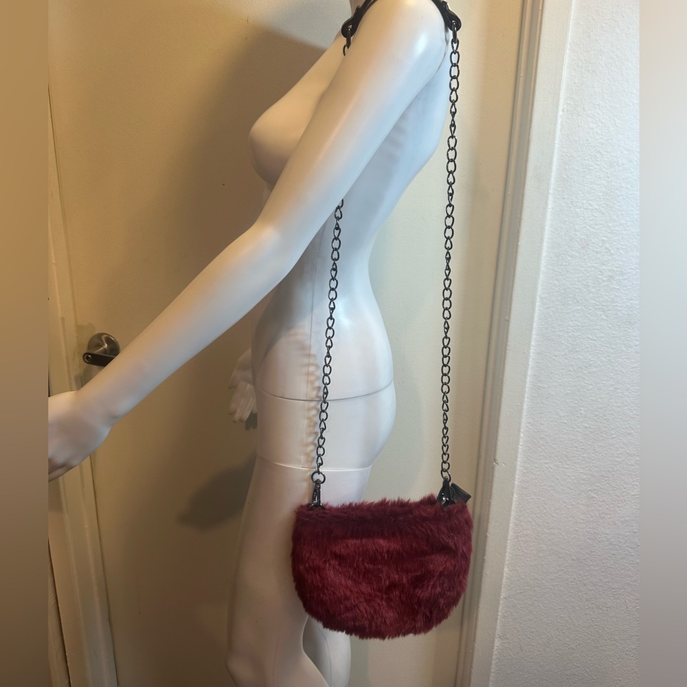burgundy fur purse with chain and leather strap
